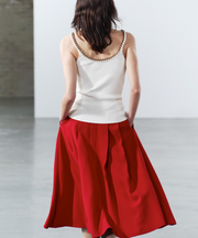 PLEATED CAPE SKIRT